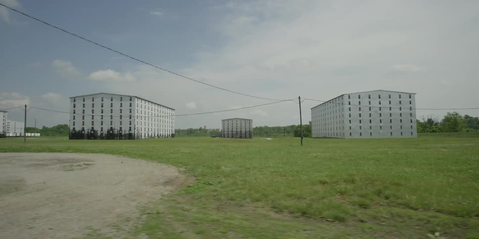 Large white buildings in a field