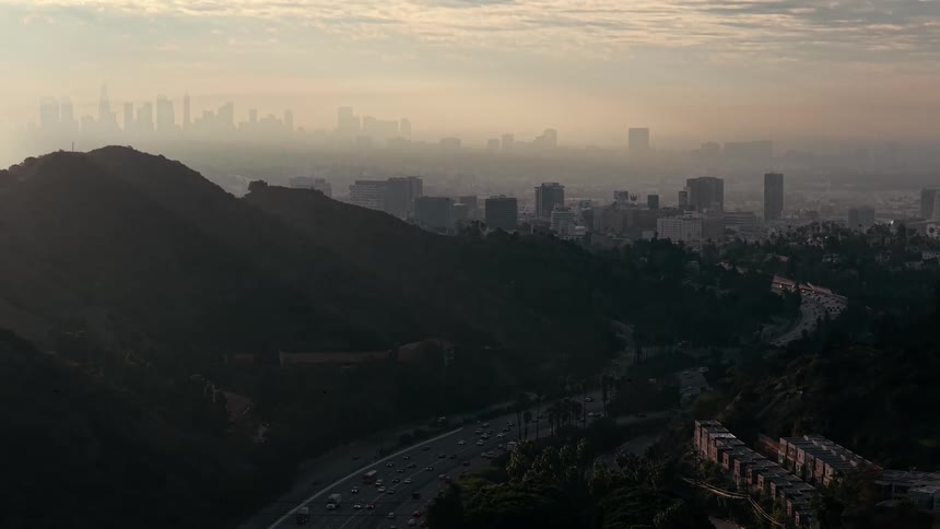 The city ahead is covered in heavy fog