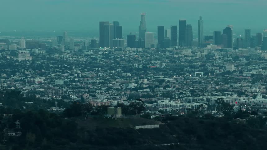 A city is dark in the early morning hours