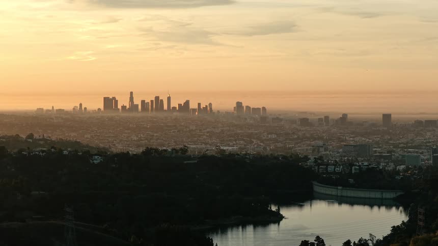 Metropolitan area next to a river outdoors during dusk or dawn