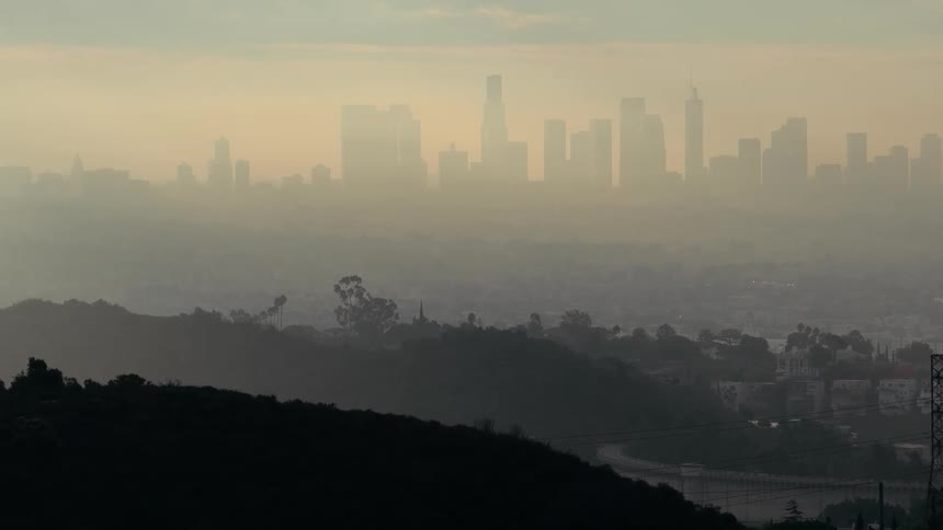 Metropolitan area covered in haze outdoors during dusk or dawn