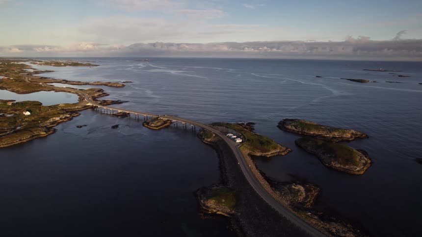 Coastal highway winding between rocky islets over calm waters