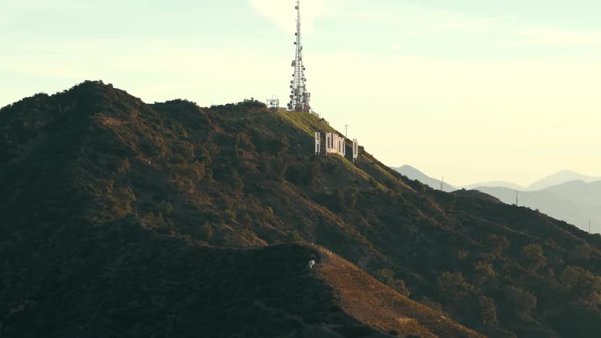 The hollywood sign stands on mount lee at sunset