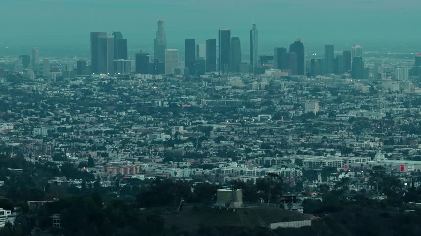 Panoramic view of los angeles with skyscrapers in the background and densely packed neighborhoods in foreground