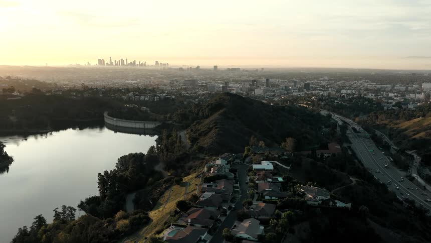 The suburbs lead to the city in the far distance