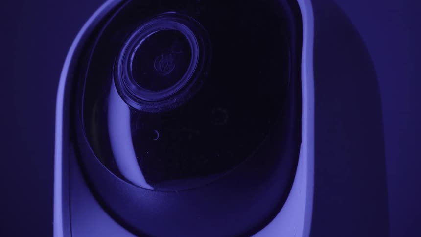 Dome security camera with lens lit in blue