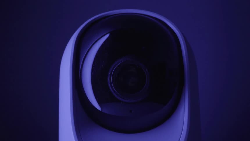 Closeup of a smart camera with its lens rotating