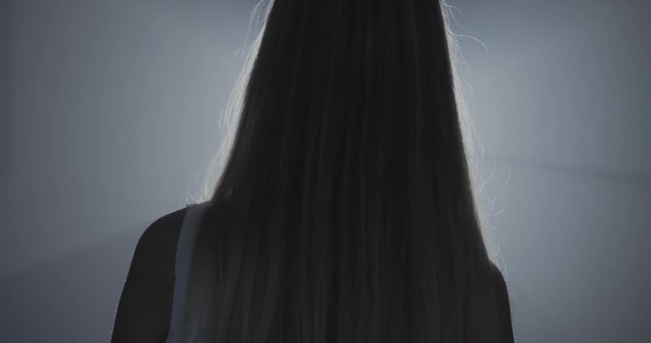 Back of a girl with long blond hair