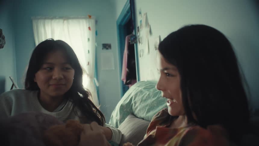 Two people talking to each other in a room