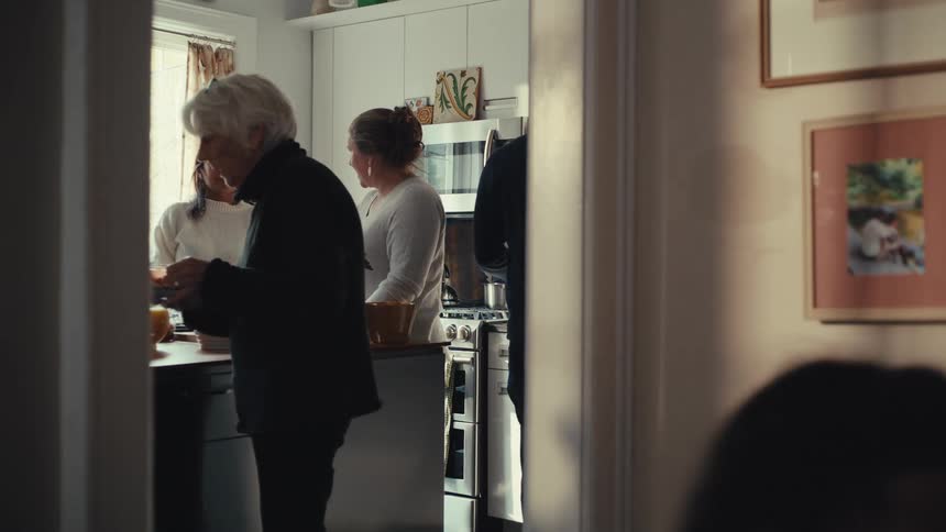 The family are bringing food from the kitchen