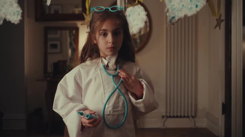 The girl is wearing a doctors costume