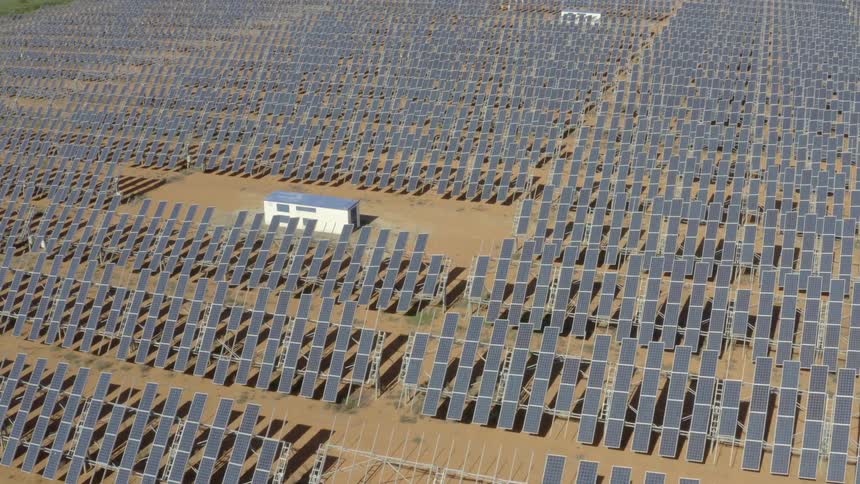 Aerial view of solar panels in a vast field