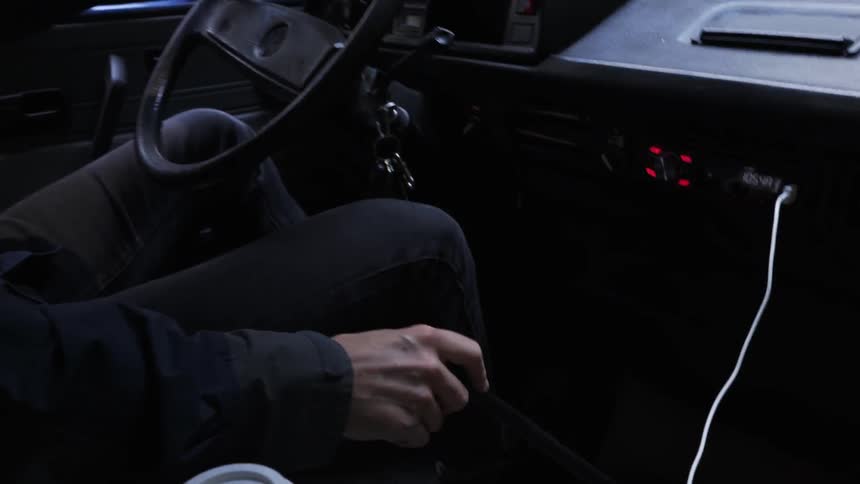 A person drives near the forest