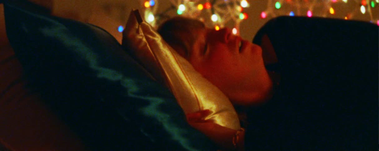 The woman is resting in bed