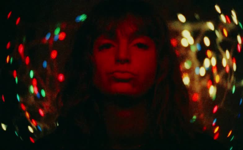Portrait of a woman with multiple facial expressions against a blurred background of christmas lights