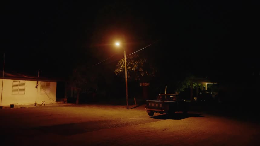 Vehicle parked in a residential area at night