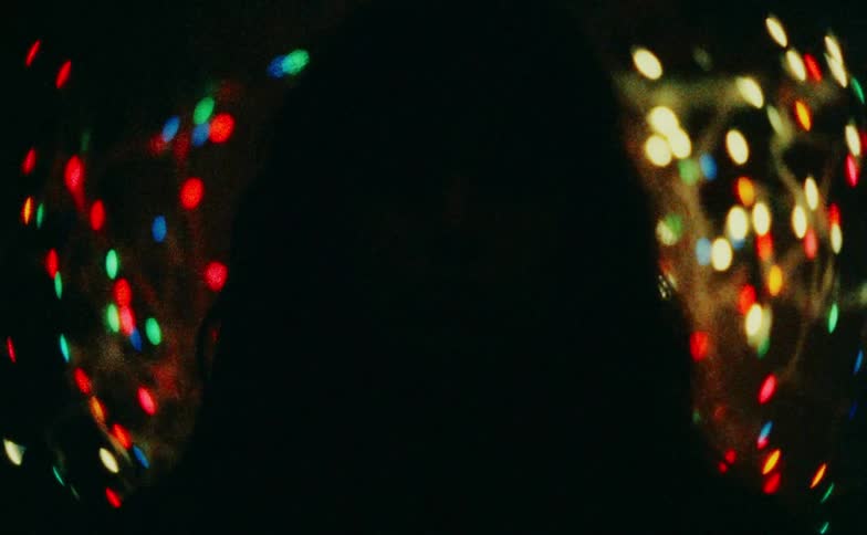Abstract light flashing on a womans face with a blurred background
