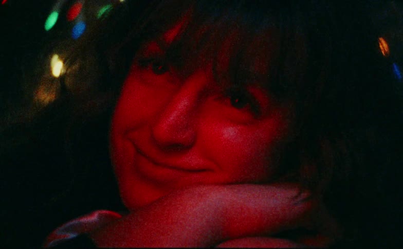 A portrait of a woman with christmas lights