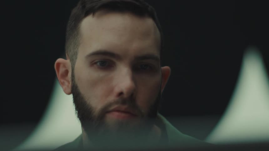 Portrait of a bearded man with a focused expression