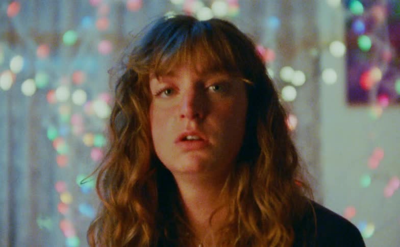 A portrait of a woman in a room
