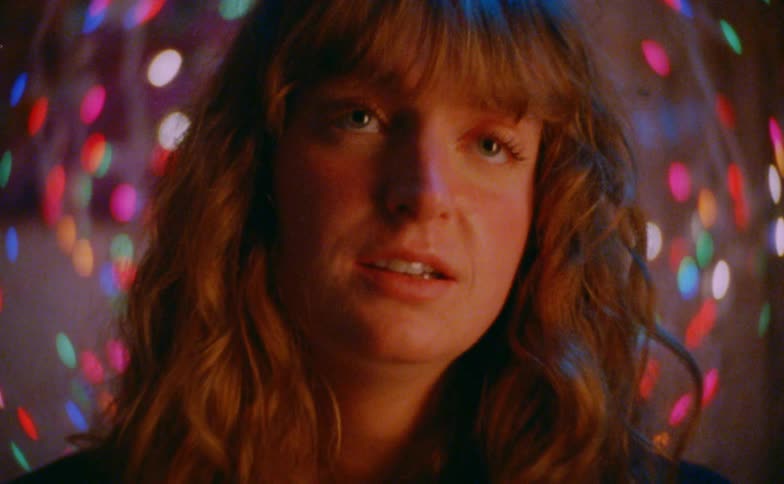 A woman looking at christmas lights