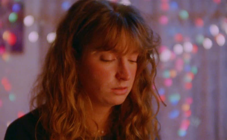 Woman in a room with colored lights