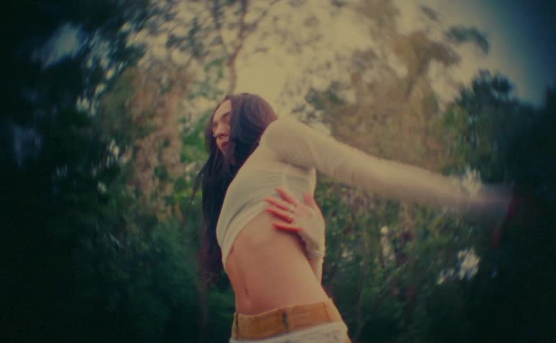 A woman dancing outdoors