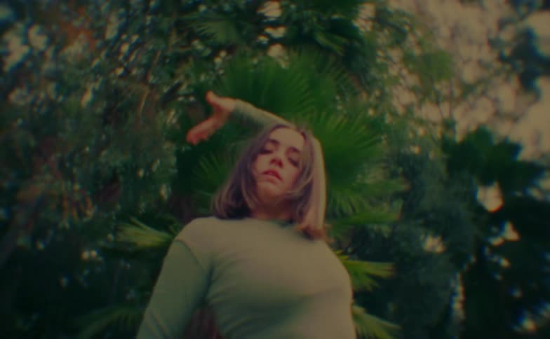 Woman dancing with a background of trees