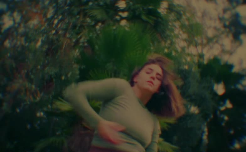 A woman dancing outdoors