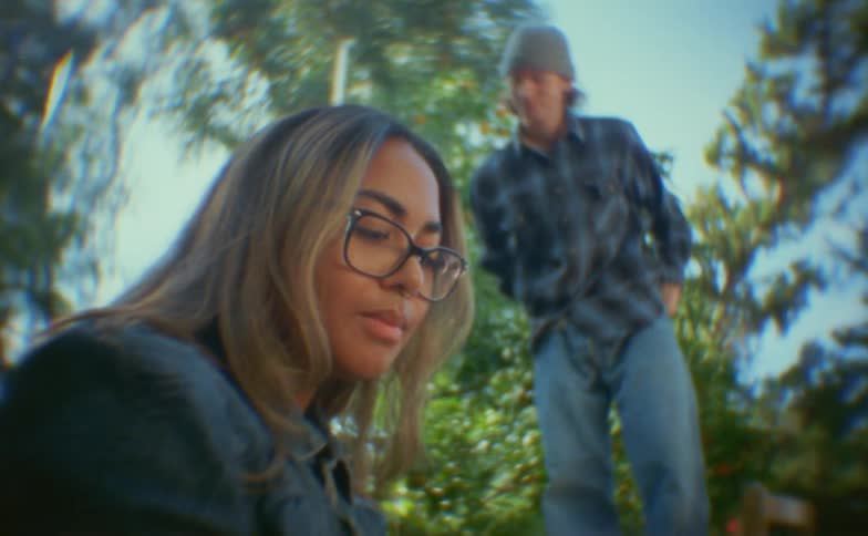 A man and woman talking outdoors