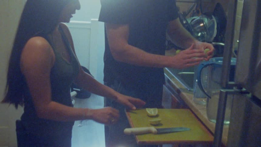 Man and a woman are preparing a drink