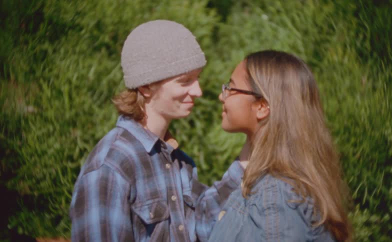 A man and woman holding each other