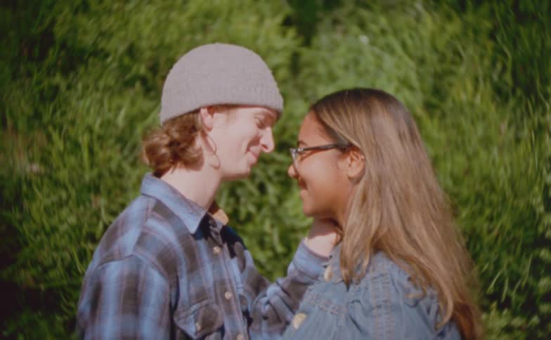 The teenager touches the girls face