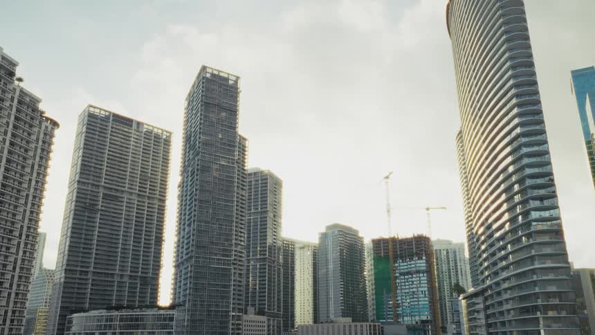 Aerial footage of high-rise condominiums near the shoreline of Downtown Miami Florida