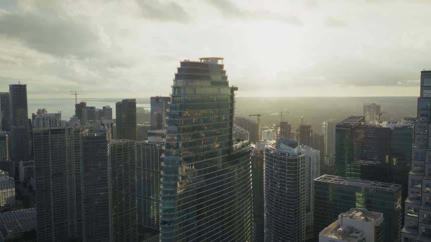 Flying through downtown Miami with tall skyscrapers