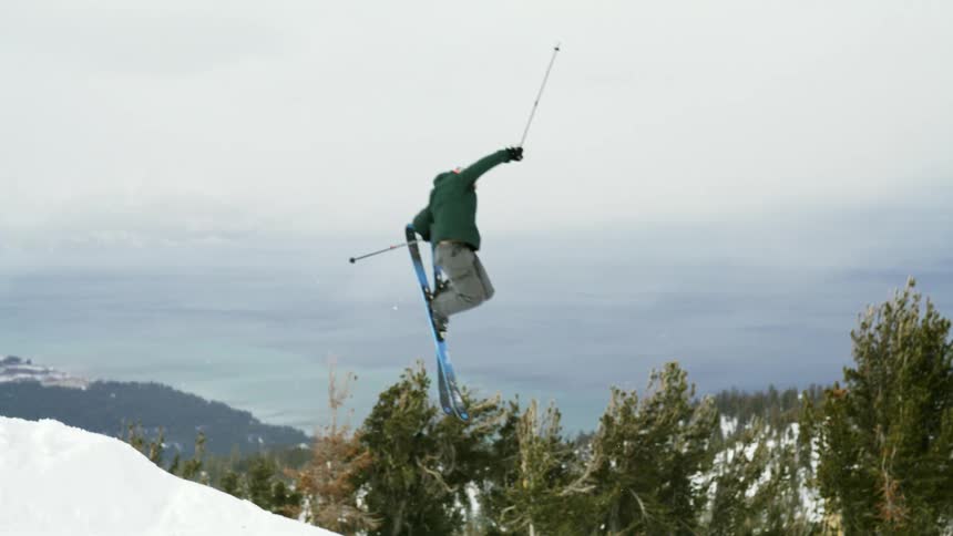 Person performing an aerial skiing maneuver on snow