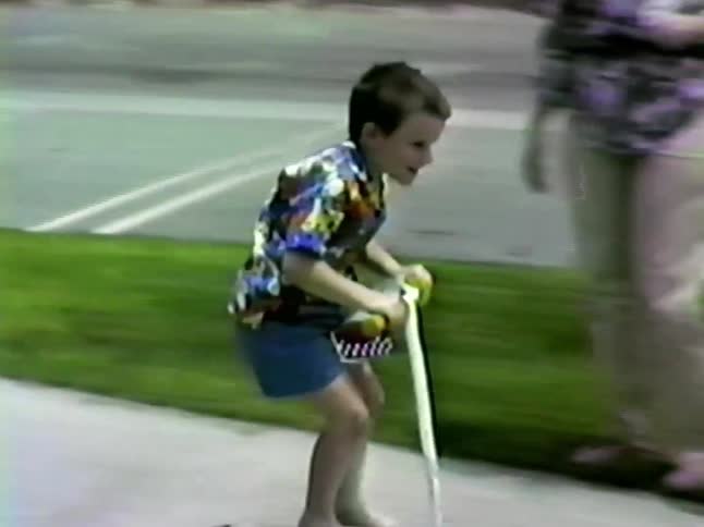Children accompanied by adults playing on roller skates