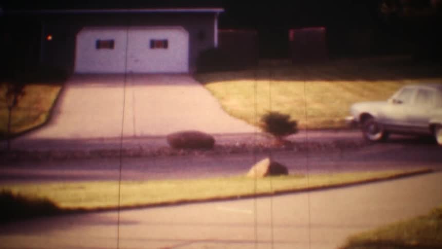 Some cars driving out of a driveway