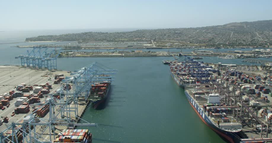 Large shipping boats at freight harbor docks in Long Beach, California
