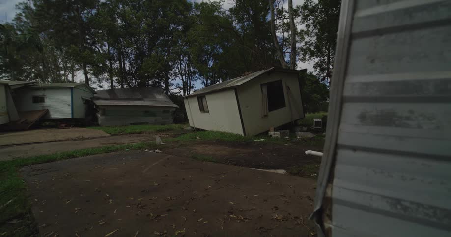 Broken wooden houses on a rural neighborhood outdoors during day time