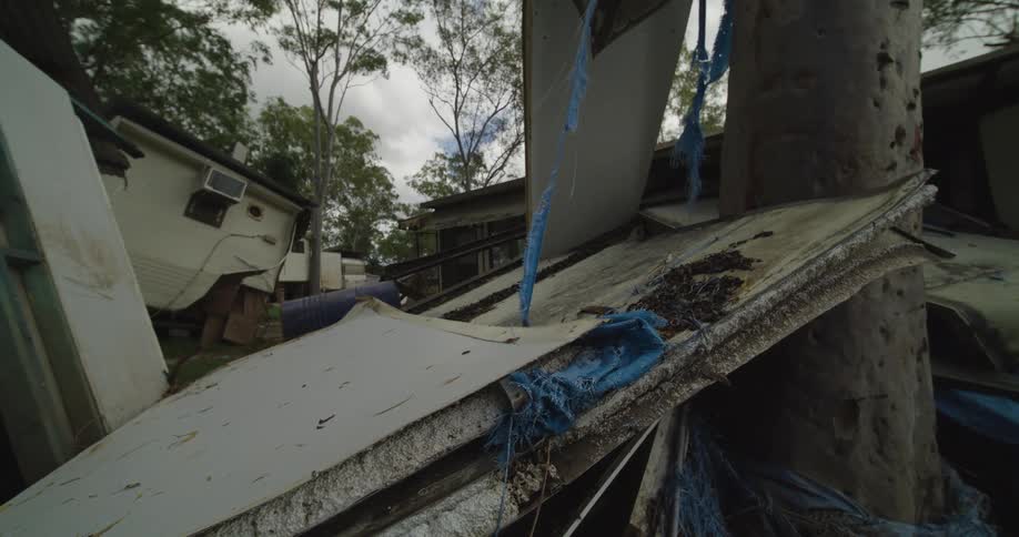 Debris fills the lot outside