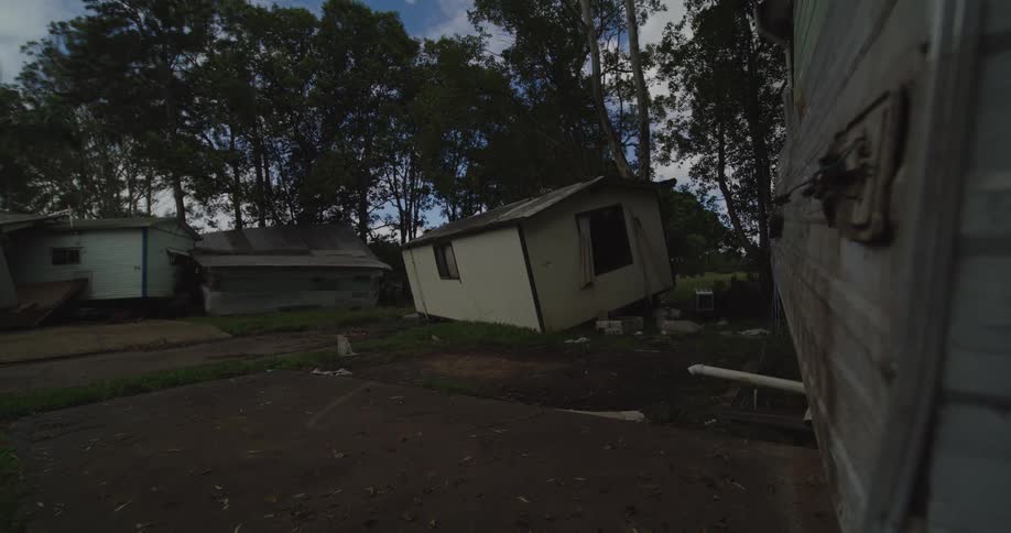 The trailers are heavily damaged in the forest