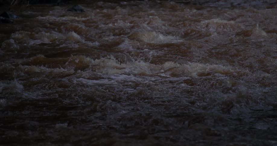 A rapid river at night