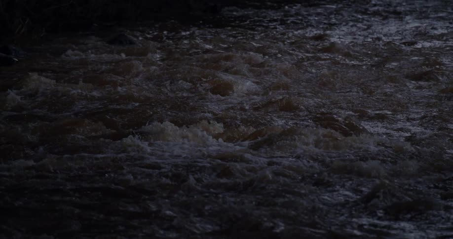 A rapid river at night