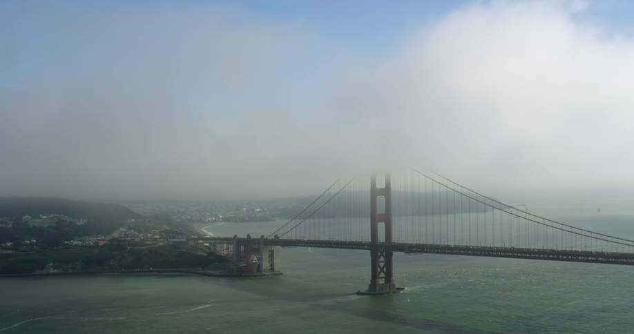 Fog lifts above the Golden Gate Bridge in San Francisco, California