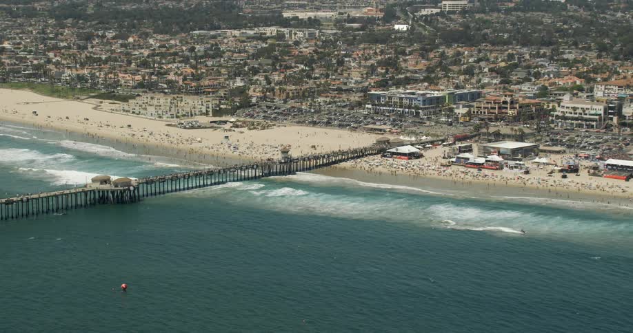 A pier goes out into the water on this beach in Huntington Beach, California