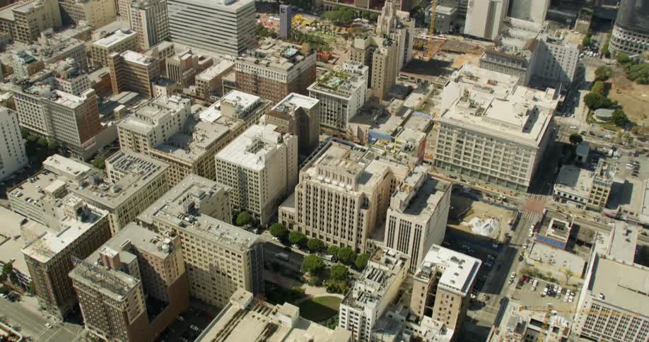 Many buildings below have heavy traffic on the roads in Los Angeles, California