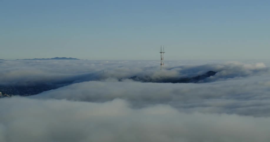 A tower stands above clouds San Francisco, California