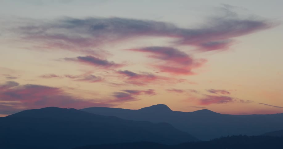 The sun is rising on the mountain range