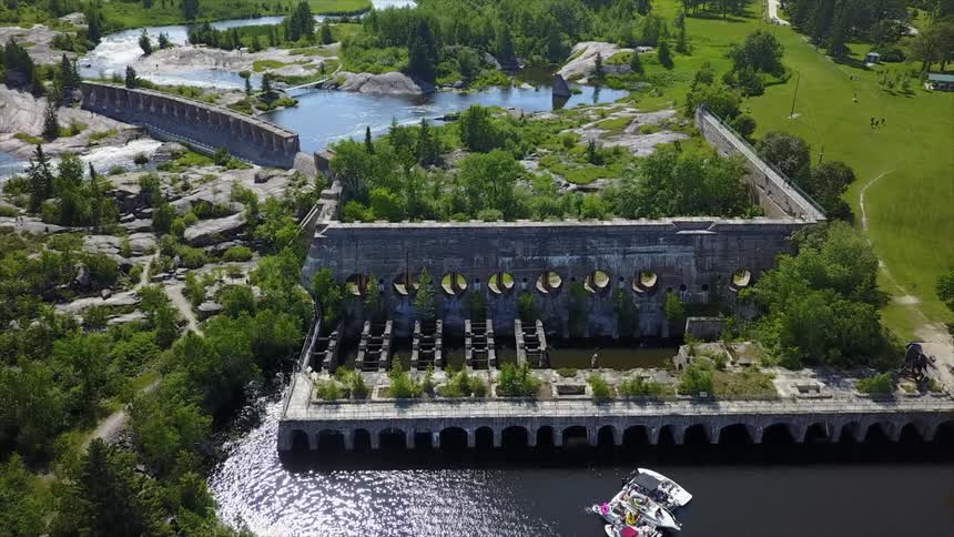 Aerial view of a lake next to a ruined building